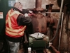 MBTA Outside Machinist Dave Fetherston working on a pump inside the tunnel system.